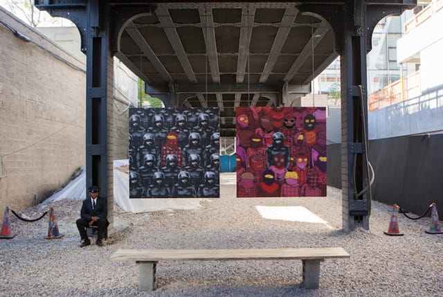 The Os Gemeos and Banksy collaboration is on display in Chelsea, under the High Line (via banksy.co.uk)