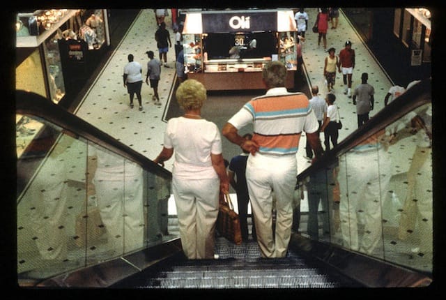 "Couple on an Escalator" from Michael Galinksy's project "Malls Across America"