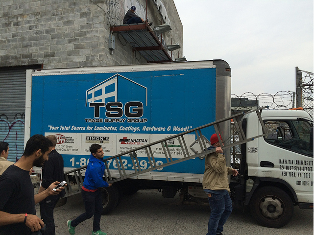 His friends bring a ladder.