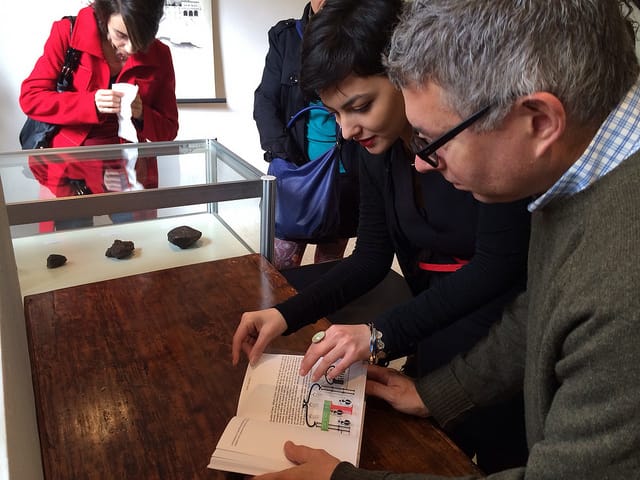 Artist Mark Dion looks at Siena Art Institute student Serena Cestari's typographic translation of Italo Calvino's Invisible City. (alll photos by the author for Hyperallergic)