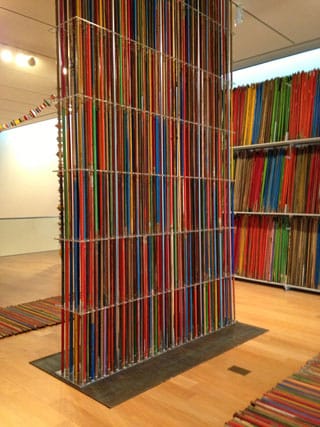 Thomas Glassford, "Broomsticks" (2013), 7,000 wood broomsticks, library shelves