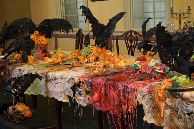 Detail of Valerie Hegarty's "Tablecloth with Fruit and Crows" (2013), in the Cane Acres Plantation dining room