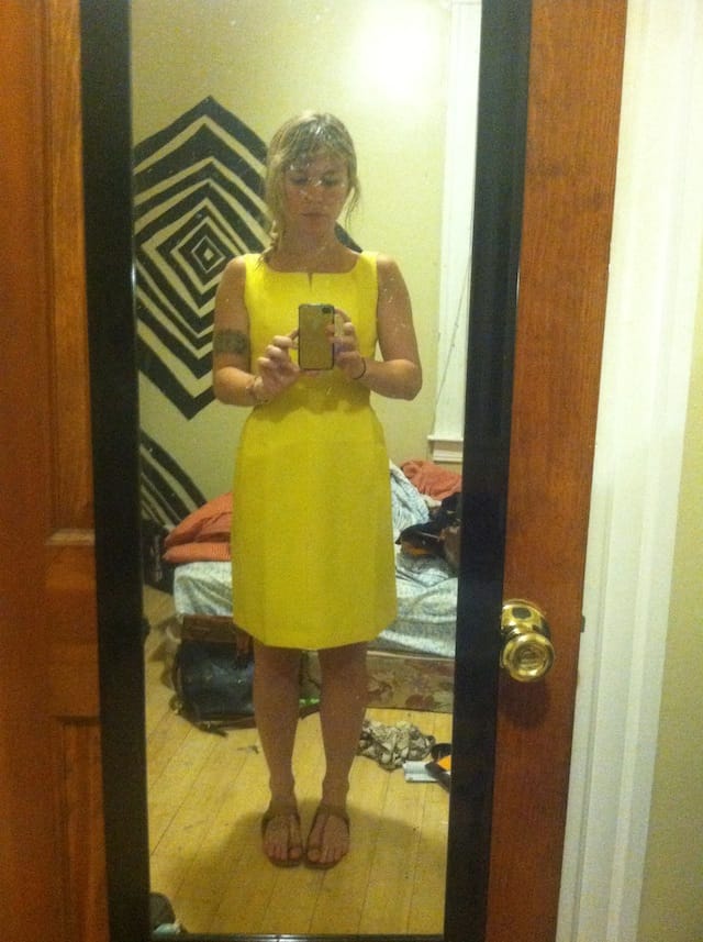 Lisa Yanni snaps a selfie of herself in a dress that she found at a thrift store and prettied up for a wedding. 