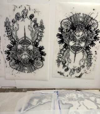 Some demon heads by Swoon.