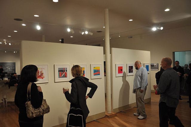 Visitors looking at the Ten x Ten print suite (photo by Renee Robbins)