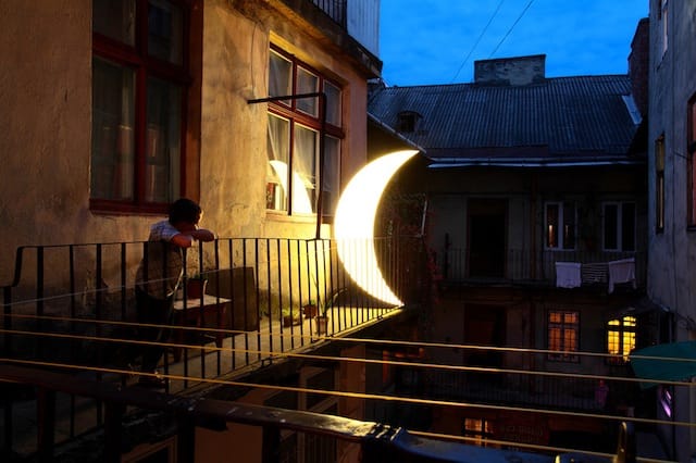 A boy and the "Private Moon" in Lviv, Ukraine, 2012