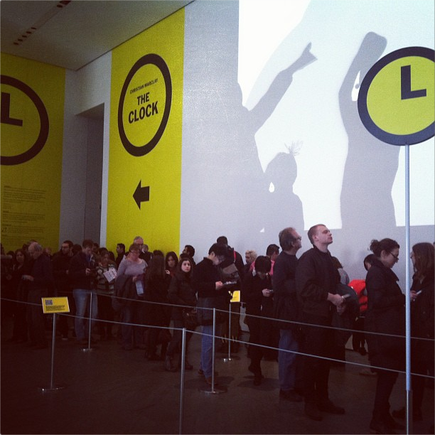 Visitors waiting to see "The Clock" at MoMA (photo by Jillian Steinhauer for Hyperallergic)