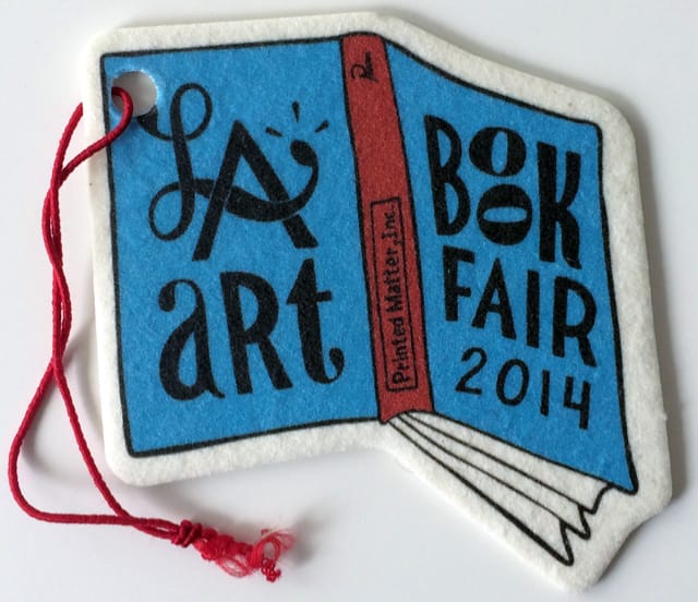 ;;; designed this LA Art Book Fair car freshener that smells citrusy fresh! (all photos by the author for Hyperallergic unless otherwise noted)