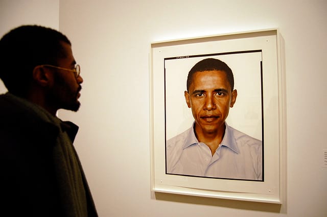A man looks at Richard Avedon's portrait of President Obama (photo by Flickr user Mr_CRO)