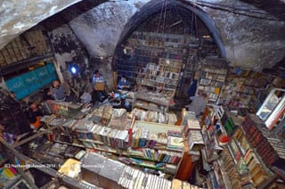 Volunteers working to restore the Al-Saeh library (photo © Natheer Halawani, via dustywyndow.blogspot.com) (click to enlarge)