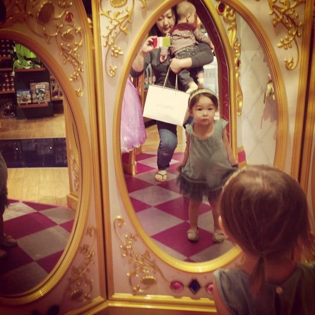 "So apparently these mirrors only talk to you if you have an official Disney princess dress on or a wand in hand. Bea kept trying to find the "magic" in her dress to have the fairy god-mothers come alive as other girls in their plasticky outfits came by." Image by sherrymain via Flickr. 