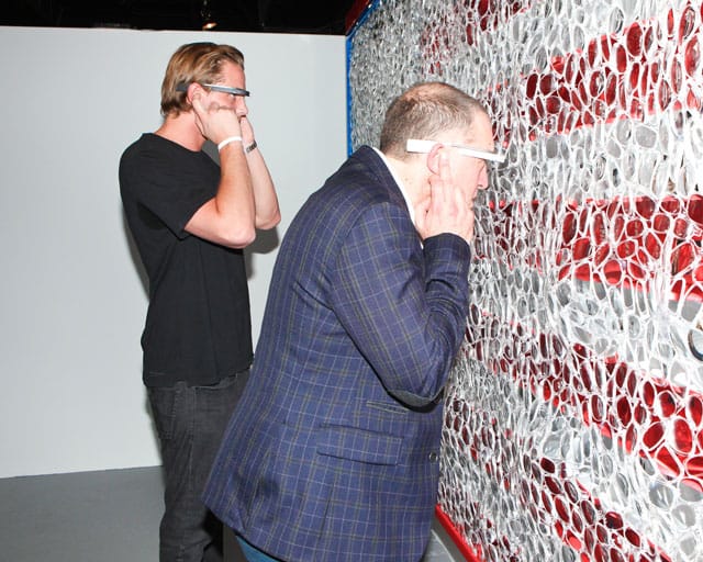 Viewers wearing Google Glass and interacting with David Datuna's "Portrait of America" (2013)