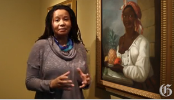 Art historian Charmaine Nelson with a 1786 painting by François Malépart de Beaucourt of a Canadian slave. (screenshot from Montreal Gazette)