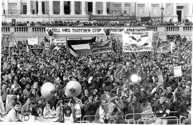Demonstrators in Trafalgar Square in 1990 (photograph by Cameron Brisbane, courtesy AAM)