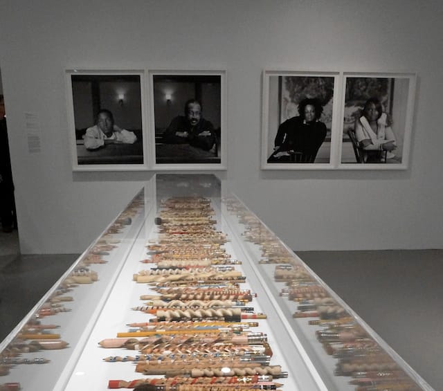 Dawoud Bey's prints from "The Birmingham Project" (2012) hanging behind Peter Schuyff's carved pencils