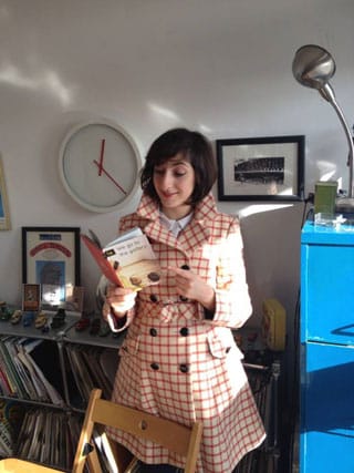 Artist Miriam Elia with a copy of 'We Go to the Gallery' (via miriamelia.co.uk)