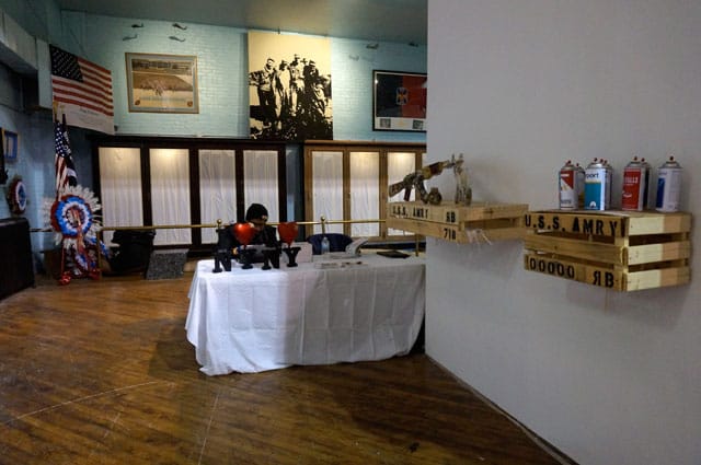 Cheeky military art at right, flag of heroes at left