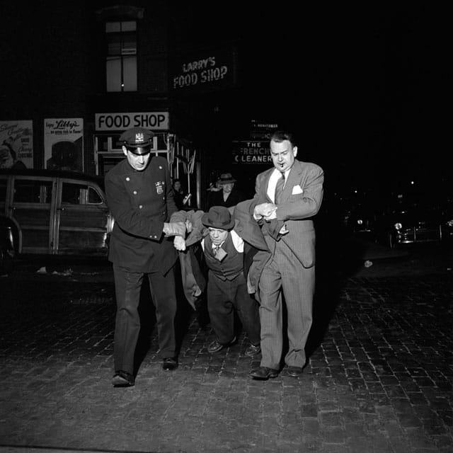 Man being dragged by cops at night, still from John Maloof and Charlie Siskel’s 'Finding Vivian Maier' (photo by Vivian Maier) (courtesy the Maloof Collection) (click to enlarge)