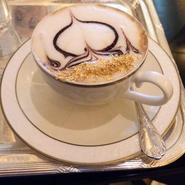 My gold surfaced cappuccino at the Emirates Palace Hotel. (all photos by the author for Hyperallergic)
