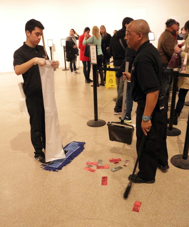 Cleaning staffers collect bills on main floor