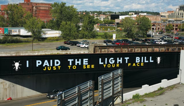 "I Paid the Light Bill Just to See Your Face" in Syracuse (photograph by Adam Wallacavage)