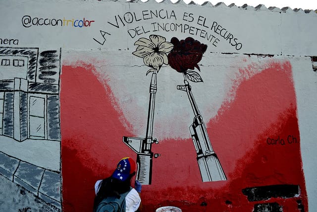 Words on a mural painted as part of the Protesta Creativa read, "Violence is the resort of the incompetent." (Image via Theily Reverol on flickr)