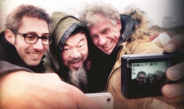 Jason Wishnow, Ai Weiwei, and Christopher Doyle take a group selfie.