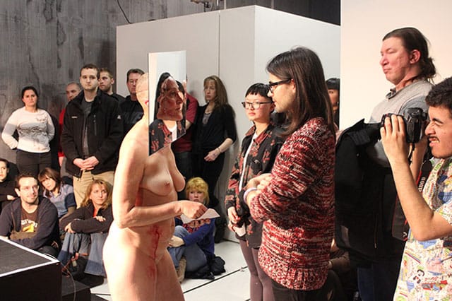 Boliver stares into the face of an audience member.