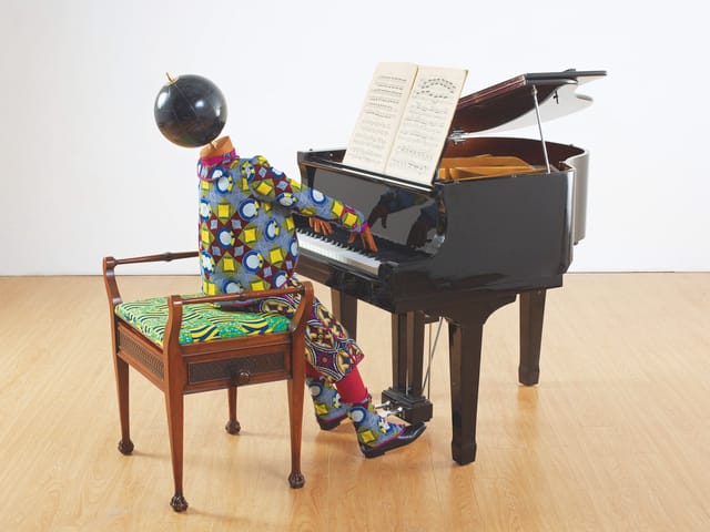Planets in My Head, Music, 2012 pp. 78-79 Life-size mannequin, fiberglass, Dutch wax printed cotton, child’s grand piano, Victorian stool, Victorian sheet music, leather, 115 x 90 x 176 cm Courtesy the artist; Stephen Friedman Gallery, London; and James Cohan Gallery, New York/Shanghai Photograph courtesy Stephen White 