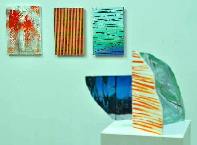 Paintings by (left to right) Patrick Berran, two works by Shawn Powell, and a sculptural work by Jennifer Shepard.
