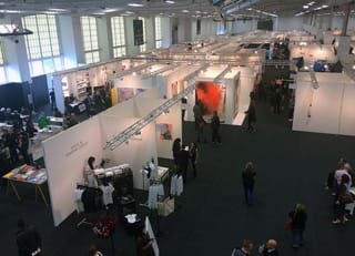 Looking over the booths at NADA New York 2014, with the American Apparel booth on the bottom left.