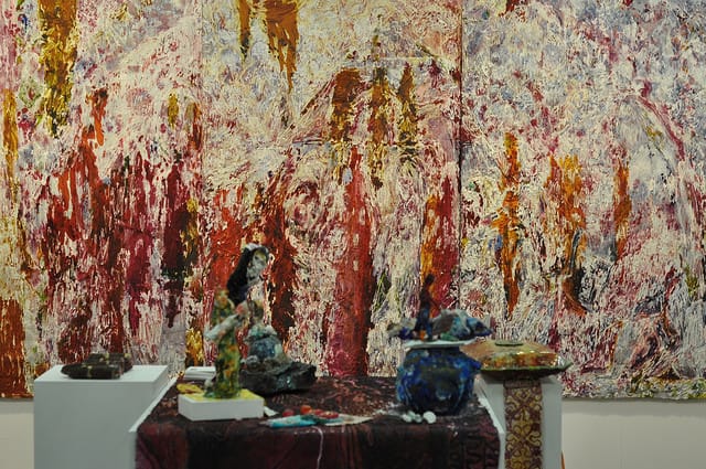 A triptych by Summer Wheat with some of her sculptures in the foreground at Samson gallery.