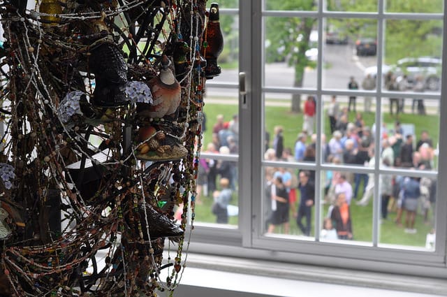 Looking from an upstairs gallery to the lawn where visitors were lingering after the Cave performance.