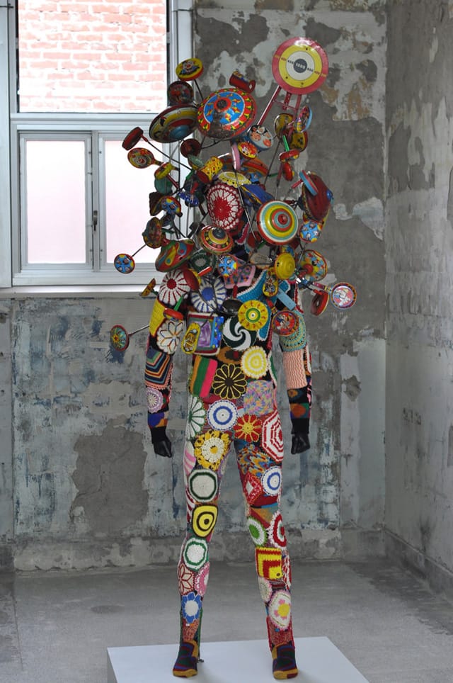 "Soundsuit" (2011) in one of the lobby spaces.