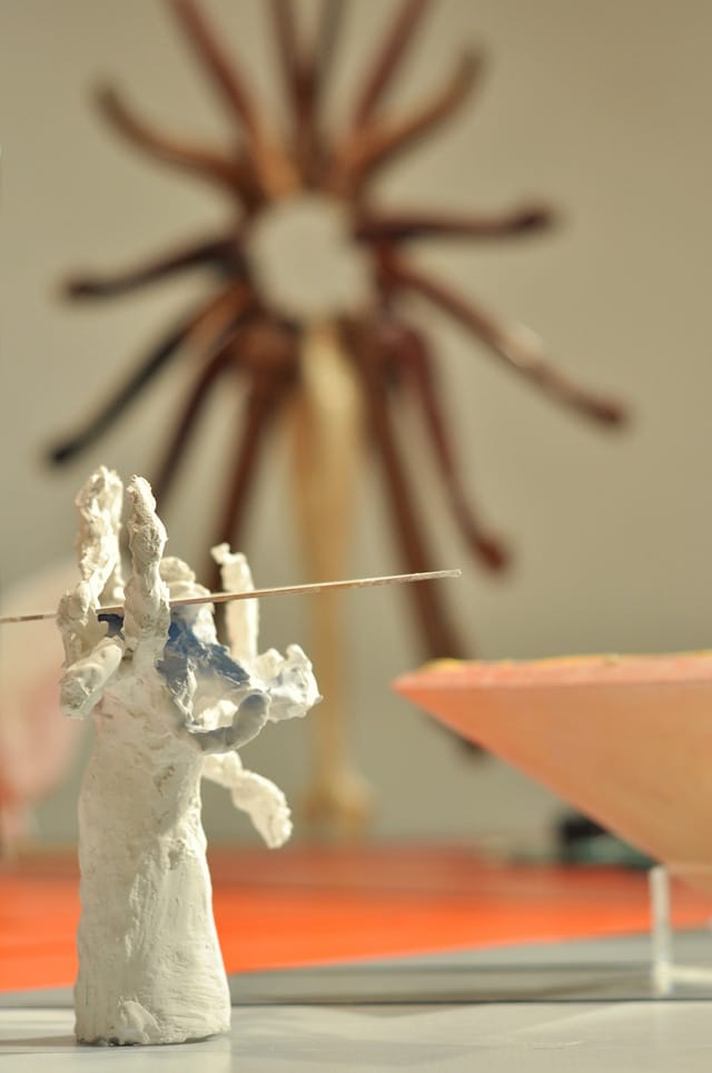 Joy Curtis's "3 Grandmas" (2014) with Marc Andre Robinson's mandala-like sculpture in the back.