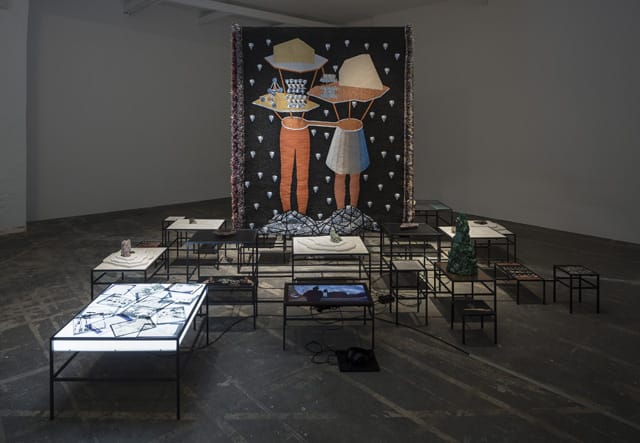 Otobong Nkanga, "In Pursuit of Bling, 2014), videos/Inkjet prints, lightbox, metal modulated structure, minerals, objects, texts, videos with sound, woven textile pieces, Dimensions variable, Installation view (image courtesy Otobong Nkanga, photo by Anders Sune Berg)