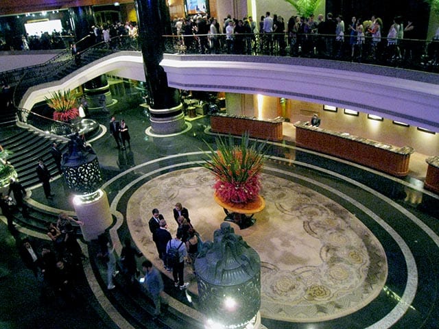 Line to get into party at Grand Hyatt, snaking along the top down to the foyer
