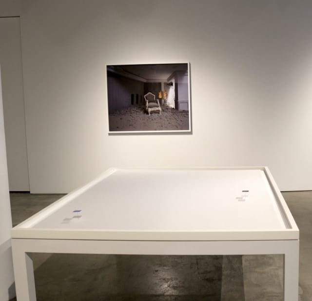 Front to back: Wafaa Bilal, “Erasing” (2014), altered archival inkjet photograph, squares cut from “Pool” (2014) pinned to surface; “Chair” (2003–13)