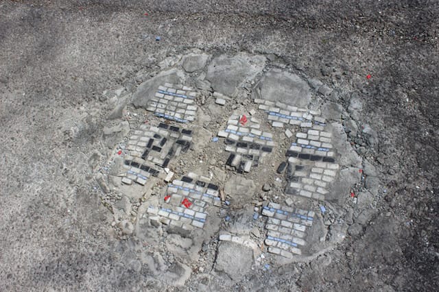A pothole mosaic of Bachor's that's cracked with the weather