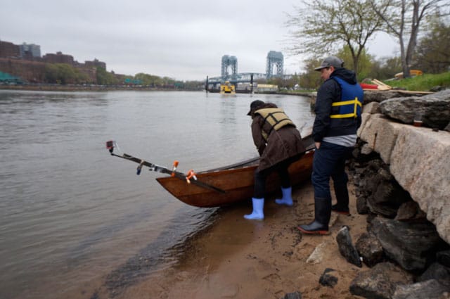 Lorenz and artist Daniel Rich launching the boat