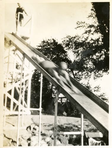 Anonymous, "Woman on Slide," American, 1930s, Silver Gelatin Print. Collection of Marc Boone Fitzerman.