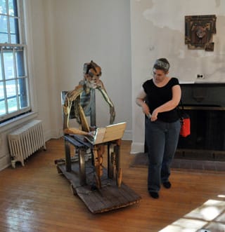 A visitor to last year's Governors Island Art Fair checking out a sculpture by Brian Fernandes-Halloran (photo by Hrag Vartanian/Hyperallergic)