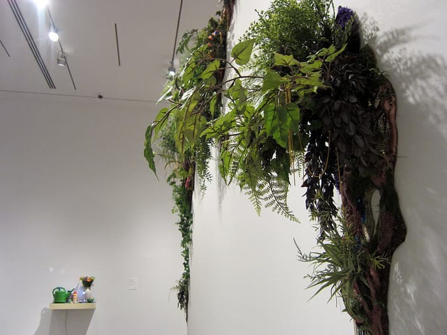 Lina Puerta, "Untitled 10" from the "Botánico Series" (2011), polyurethane foam, wood, resin, paint, fabric, fiberfill, buttons, rhinestones, trims, beads, moss, artificial & live plants