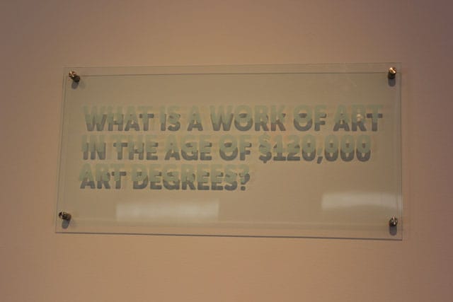 Caroline Woolard, 'Statements,' ongoing series of etched office plaques, on view in 'NYC Makers' (photo courtesy the Museum of Arts and Design)