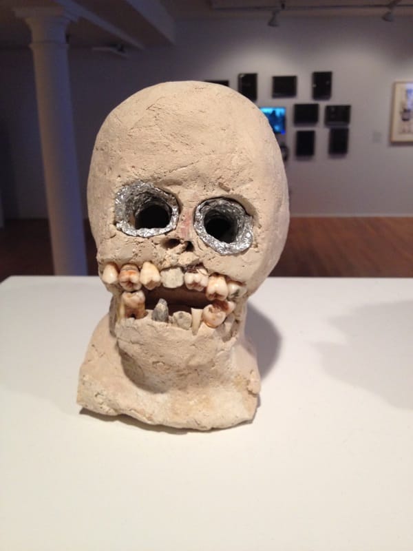 James “Son” Thomas, "Skull" (1988), unfired clay, human teeth, rocks, and aluminum foil, 7 x 4 1⁄2 x 7 in (The William Arnett Collection of the Souls Grown Deep Foundation)