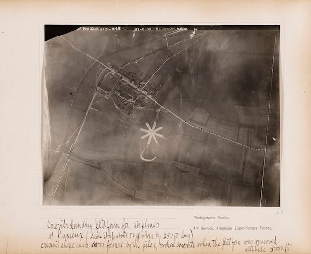 Concrete landing platform for airplanes at Puxieux (each strip about 50 ft. wide by 250 ft long), crescent shape mass was formed by the pile of broken concrete when the platform was removed, altitude 15,000 ft., August 23, 1918. Gelatin silver print, from loose-leaf album of aerial photographs from the Photographic Section, Air Service, American Expeditionary Forces, World War I. The Art Institute of Chicago, gift of William Kistler. © 2014 The Estate of Edward Steichen/Artists Rights Society (ARS), New York.