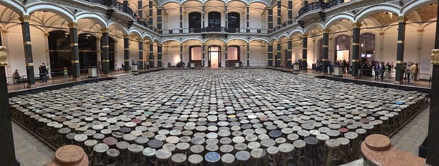 A view of the atrium of the Martin-Gropius-Bau with Ai Weiwei's "Stools" (2013), wooden stools