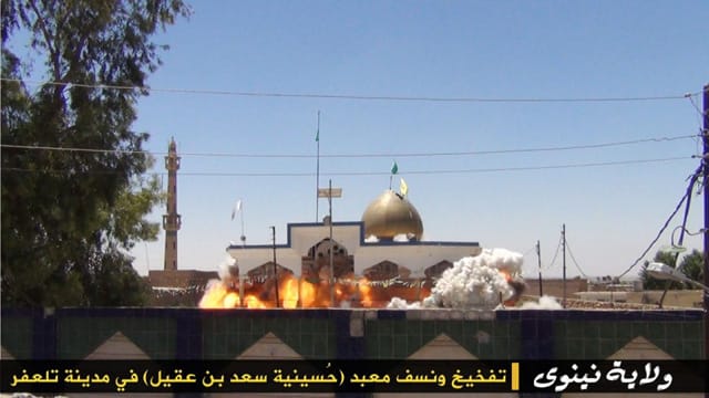 A Shiite Islamic site being destroyed by explosives (via Al Arabiya)