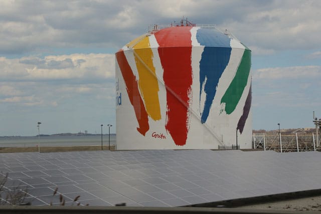 Corita Kent's "Rainbow Swash" on a natural gas storage tank in Boston (photo via Ktr101/Wikimedia)
