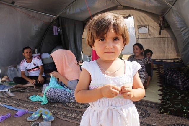 Iraqi refugee girl with her family at Newroz camp where they are being helped by the International Rescue Committee (via UK Dept. for Int'l Development's Flickrstream)